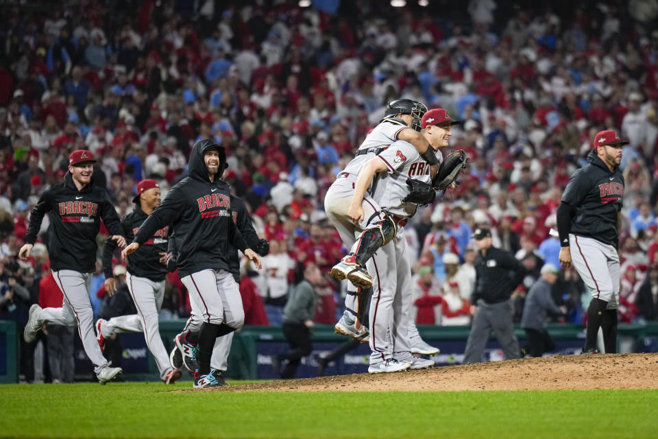 The Arizona Diamondbacks celebrate their win against the Philadelphia Phillies in Game 7 of the baseball NL Championship Series in Philadelphia Wednesday, Oct. 25, 2023. (AP Photo/Matt Slocum)