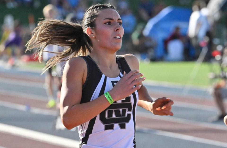 Clovis North’s Emerson Parks looks up to the scoreboard to see her first place finish in the 400 at the CIF Central Section Masters track and field meet, held at Veterans Memorial Stadium on Saturday, May 20, 2023 in Clovis.