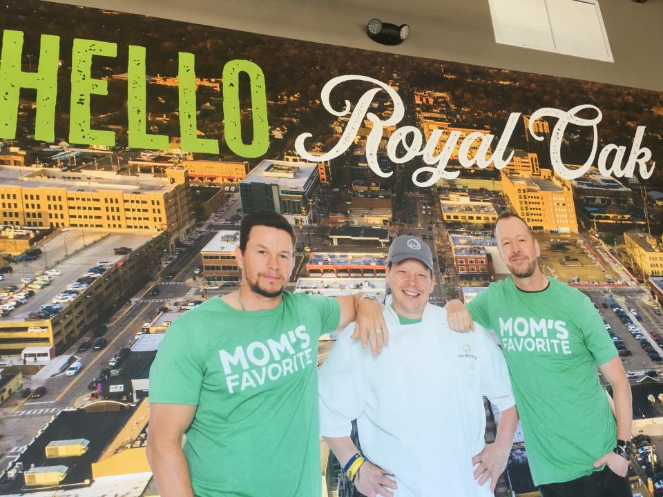 A poster with the Wahlberg brothers at the new Wahlburgers in Royal Oak.