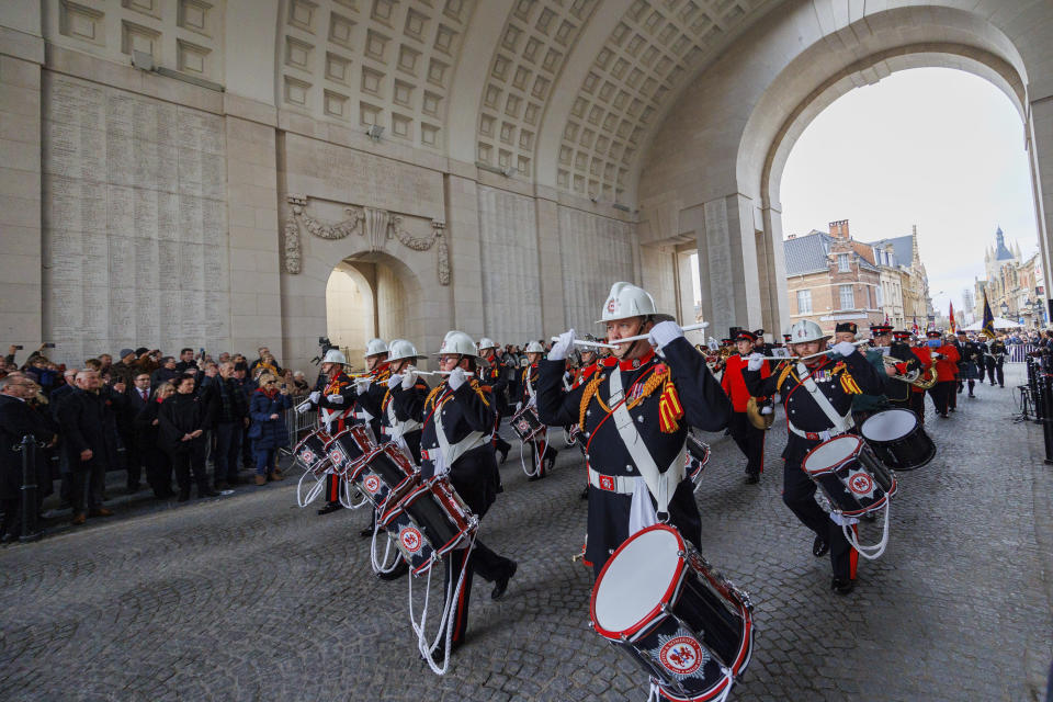 A drums and pipes band marches during an Armistice Day ceremony at the Menin Gate Memorial to the Missing in Ypres, Belgium, Friday, Nov. 11, 2022. Since the end of World War I in 1918, millions of visitors, from as far away as the U.S., New Zealand, and South Africa, have flocked to memorials in northern France and Belgium to pay tribute to the fallen. (AP Photo/Olivier Matthys)