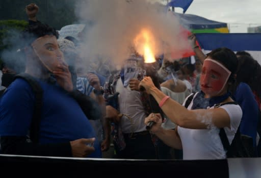 A Nicaraguan demonstrator fires a home-made mortar in Managua as part of nationwide marches against the government of President Daniel Ortega