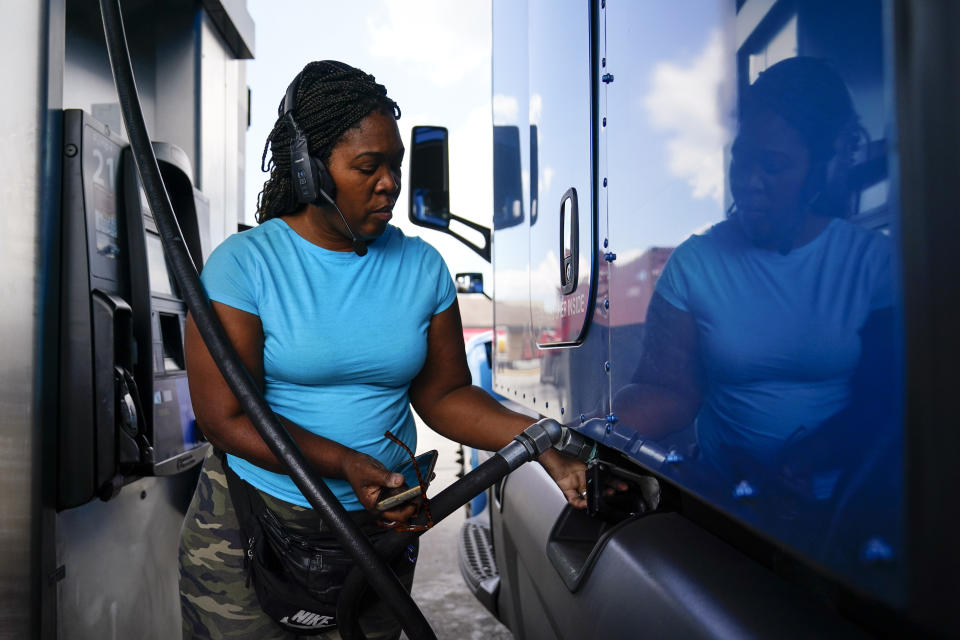 Delores Bledsoe, of Houston, Texas, fuels up her rig at a truck stop in Carlisle, Pa., Wednesday, July 13, 2022. (AP Photo/Matt Rourke)