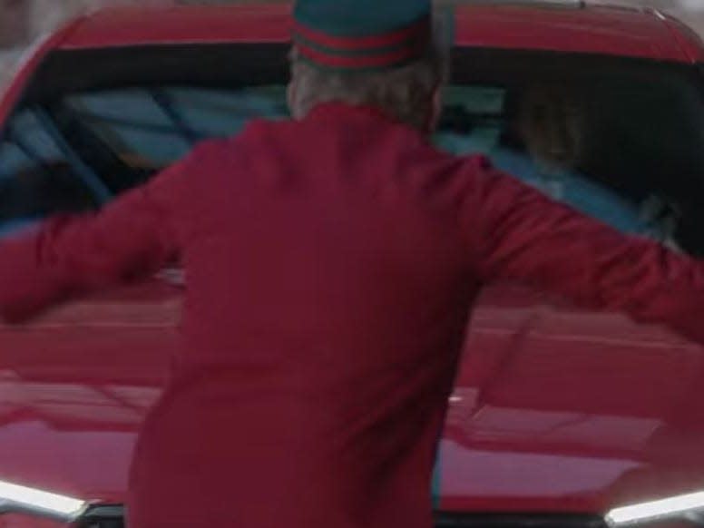 bellhop at belmont resort getting ran over by tad's car in falling for christmas