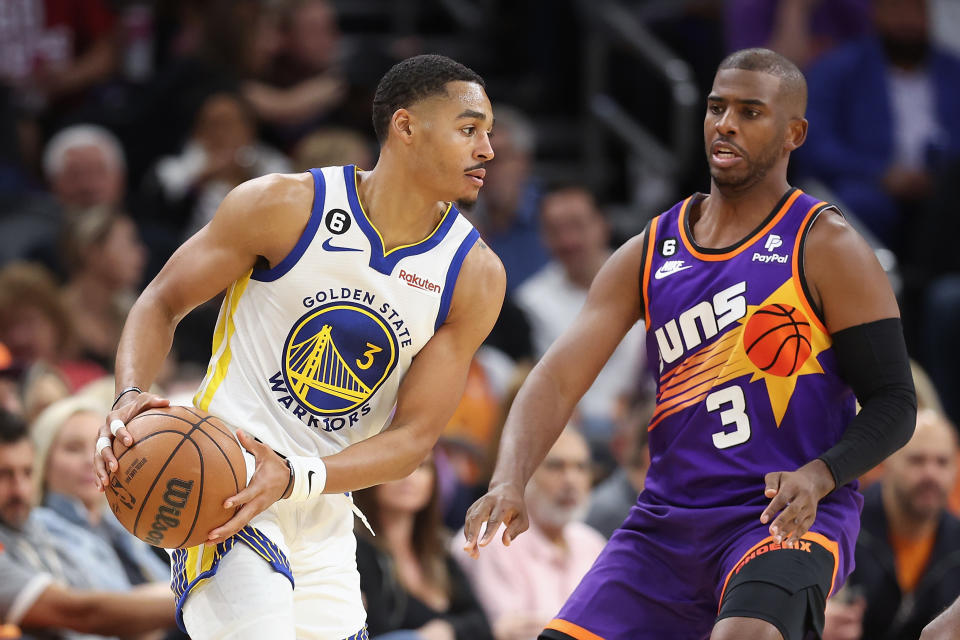 PHOENIX, ARIZONA - OCTOBER 25: Jordan Poole #3 of the Golden State Warriors handles the ball against Chris Paul #3 of the Phoenix Suns during the second half of the NBA game at Footprint Center on October 25, 2022 in Phoenix, Arizona. The Suns defeated the Warriors 134-105. NOTE TO USER: User expressly acknowledges and agrees that, by downloading and or using this photograph, User is consenting to the terms and conditions of the Getty Images License Agreement.  (Photo by Christian Petersen/Getty Images)