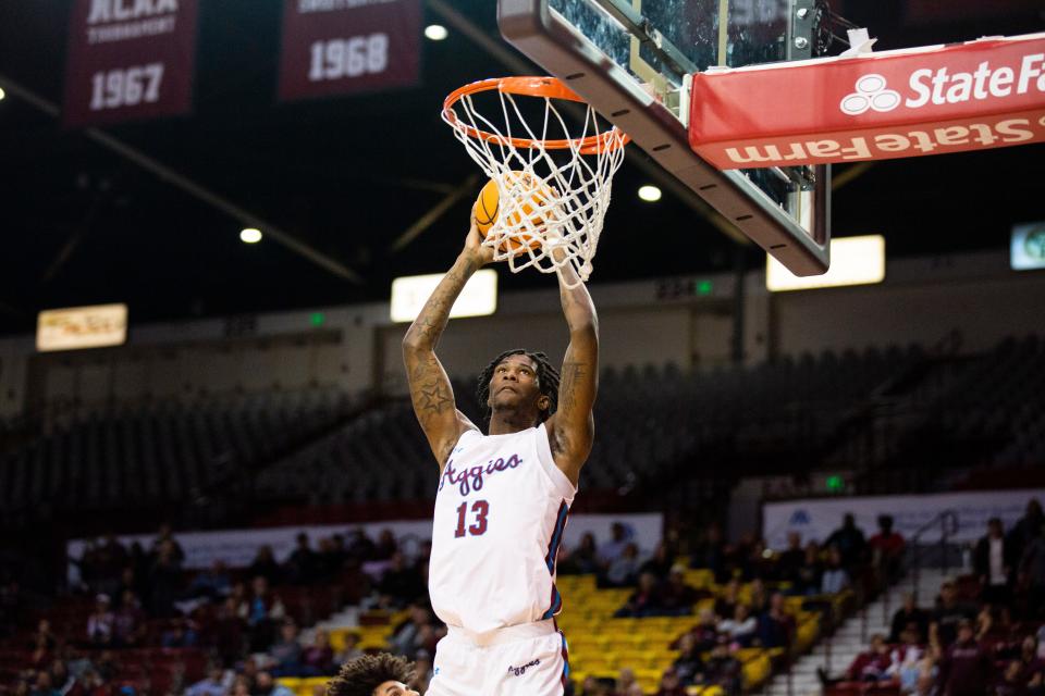 NMSU forward Doctor Bradley dunks the ball during a college basketball game on Saturday, Feb. 4, 2023, at the Pan American Center. 