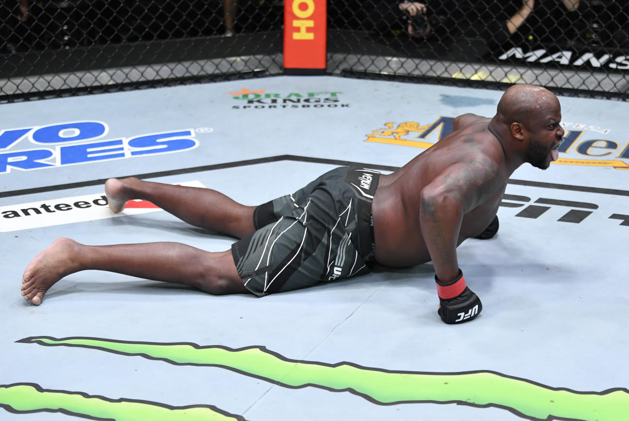 LAS VEGAS, NEVADA - DECEMBER 18: Derrick Lewis celebrates after his knockout victory over Chris Daukaus in their heavyweight fight during the UFC Fight Night event at UFC APEX on December 18, 2021 in Las Vegas, Nevada. (Photo by Jeff Bottari/Zuffa LLC)