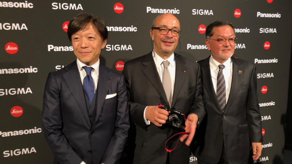 Kazuto Yamaki of Sigma, Andreas Kaufmann of Leica, and Tetsuro Homma of Panasonic announce the L-Mount Alliance at Photokina 2018