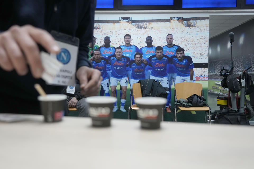 A man pours sugar into cup of espresso at the press hall of the Napoli soccer team headquarters in Castel Volturno, near Naples, Wednesday, April 5, 2023. Unlike other major cities in Italy, Naples has only one major soccer team and the fan support for Napoli is felt on every street and alleyway. Lobotka, who developed with Ajax’s junior squad and then played for Danish club Nordsjaelland and Spanish side Celta Vigo before transferring to Italy, had never experienced anything like Napoli. (AP Photo/Gregorio Borgia)