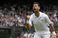 Serbia's Novak Djokovic celebrates winning a point against Russia's Andrey Rublev in a men's singles match on day nine of the Wimbledon tennis championships in London, Tuesday, July 11, 2023. (AP Photo/Kirsty Wigglesworth)