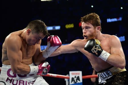 Sep 15, 2018; Las Vegas, NV, USA; Canelo Alvarez (black trunks) and Gennady Golovkin (white trunks) box in the middleweight world championship boxing match at T-Mobile Arena. Alvarez won via majority decision. Mandatory Credit: Joe Camporeale-USA TODAY Sports