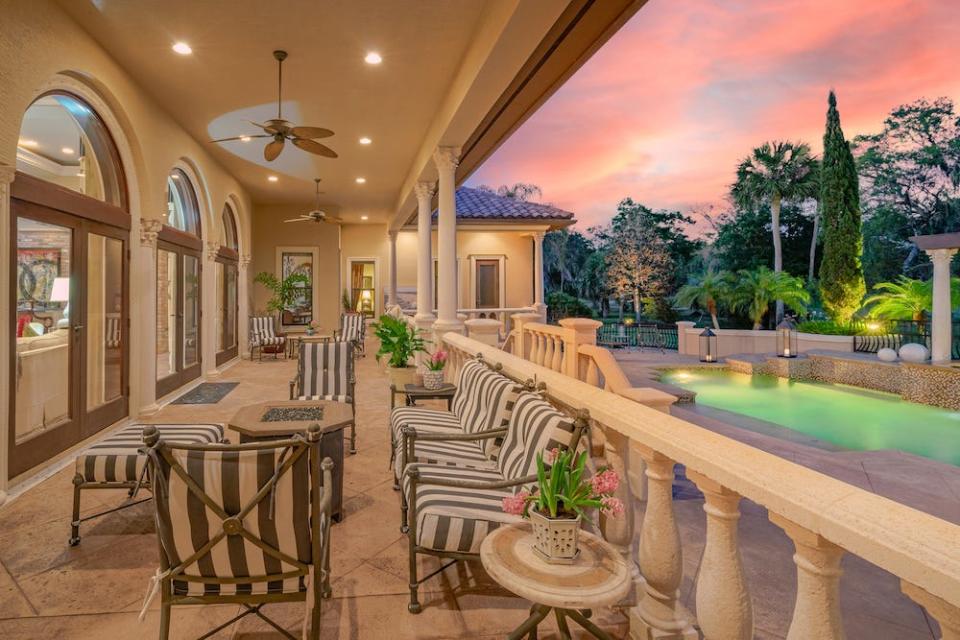 The stunning pool lanai overlooks the meticulously maintained golf course and features a built-in summer kitchen and plenty of space for entertaining.