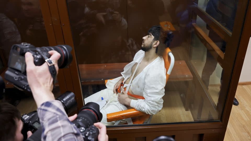 Mukhammadsobir Faizov, a suspect in the shooting attack, appeared unresponsive in court, on Sunday. - Shamil Zhumatov/Reuters