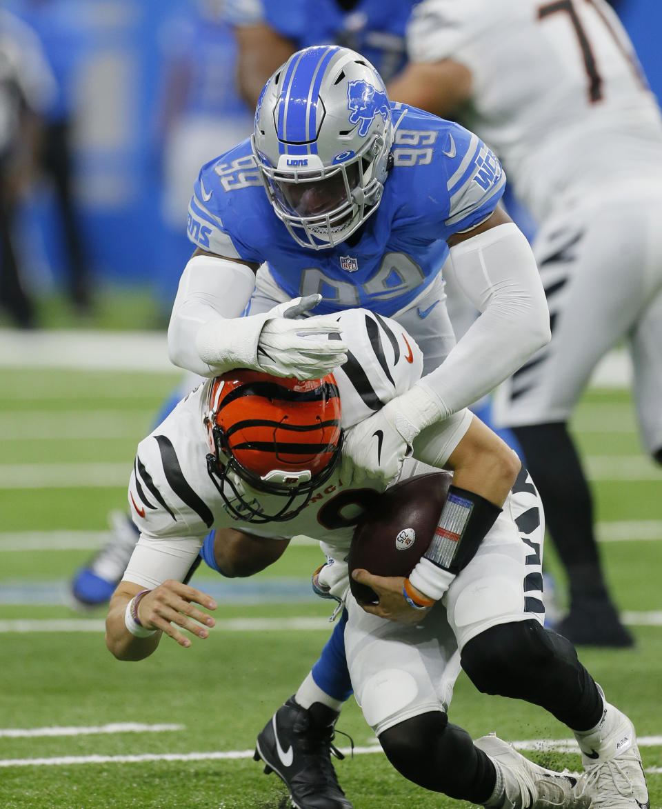 Detroit Lions linebacker Julian Okwara (99) sacks Cincinnati Bengals quarterback Joe Burrow (9) during the first half of an NFL football game, Sunday, Oct. 17, 2021, in Detroit. (AP Photo/Duane Burleson)