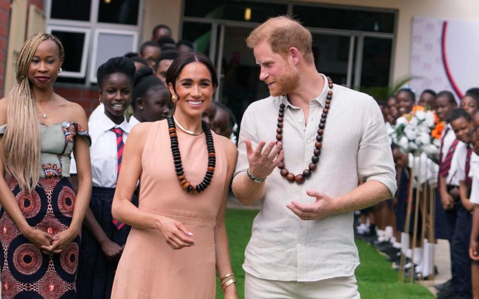 Prince Harry and Meghan visit children at the Lights Academy in Abuja, Nigeria, Friday, May 10, 2024. Prince Harry and his wife Meghan have arrived in Nigeria to champion the Invictus Games, which he founded to aid the rehabilitation of wounded and sick servicemembers and veterans.