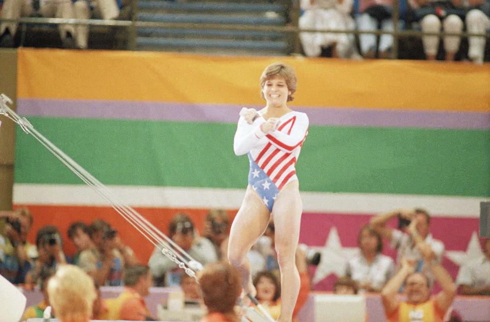 Mary Lou Retton celebrates after completing an event at the 1984 Summer Olympics in Los Angeles.