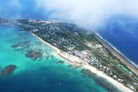<p>The capital of Funafuti from the air shows an area of successful reclaimation (L) where the Tuvalu Government is now building a convention centre to host the Pacific Island Forum in 2019 on August 15, 2018 in Funafuti, Tuvalu. The small South Pacific island nation of Tuvalu is striving to mitigate the effects of climate change. Rising sea levels of 5mm per year since 1993, well above the global average, are damaging vital crops and causing flooding in the low lying nation at high tides. (Photo by Fiona Goodall/Getty Images for Lumix) </p>