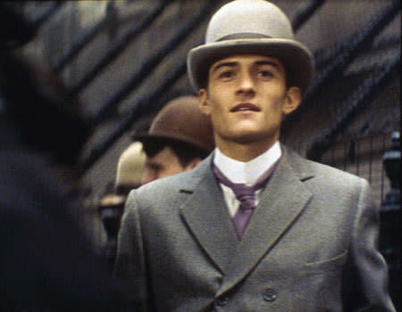 Before he graduated from drama school and scored the substantial role of Legolas in The Lord of the Rings film two days out, <b> Orlando Bloom </b> had no on-screen credits except for this 'blink and you'll miss it' scene in the 1997 biographical film about Oscar Wilde, <b>'Wilde' </b>, where he plays a 'Rent-boy' amongst more distinguished cast members (a veritable treasure trove of Brit A-listers) including Stephen Fry, Jude Law, Vanessa Redgrave, Ioan Grufford, and Jennifer Ehle.