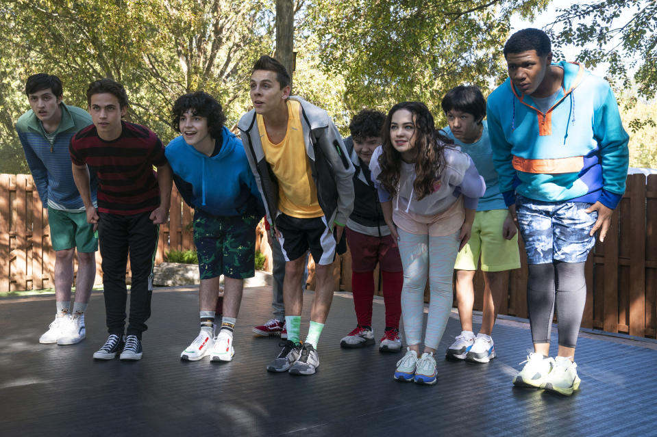 (L to R) Gianni DeCenzo as Demetri, Tanner Buchanan as Robby Keene, Griffin Santopietro as Anthony LaRusso, Jacob Bertrand as Eli ‘Hawk’ Moskowitz, Aedin Mincks as Mitch, Mary Mouser as Samantha LaRusso, Nathaniel Oh as Nate, Khalil Everage as Chris - Credit: Netflix