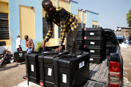 A man returns voting machines used in the elections to Congo's Independent National Electoral Commission (CENI) tallying centre in Kinshasa, Democratic Republic of Congo, January 1, 2019. REUTERS/Baz Ratner