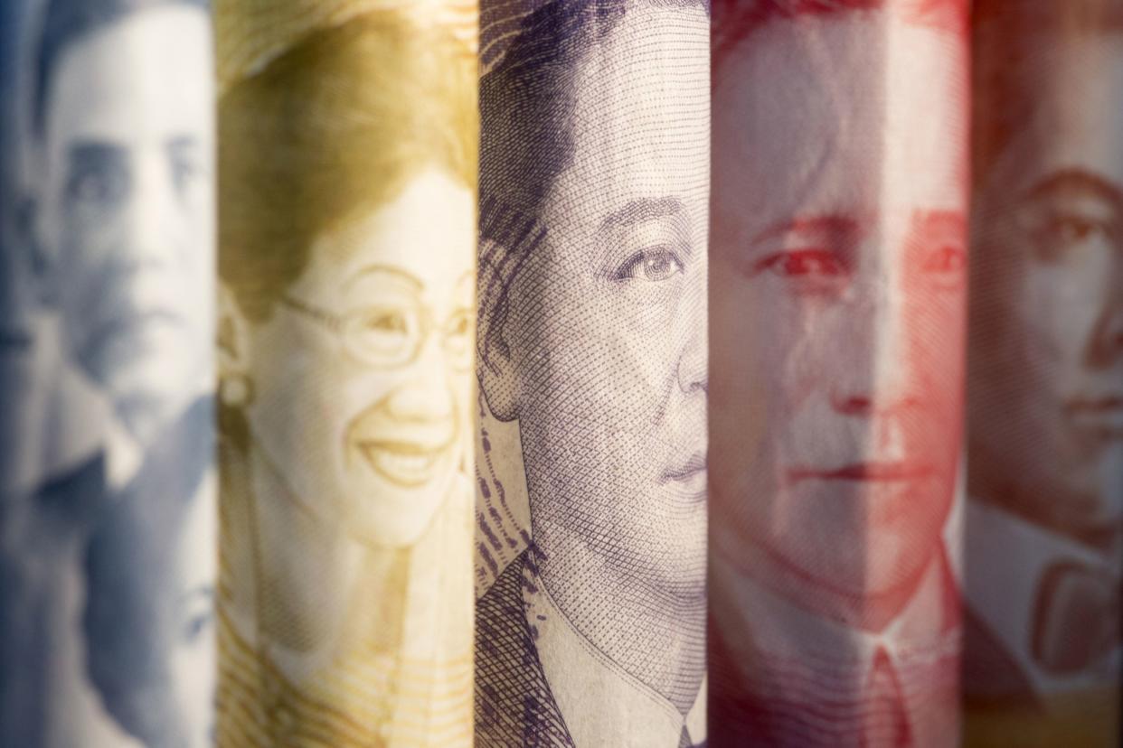 The portraits of former Philippines' Acting President Jose Abad Santos, from left, and former Philippines' Presidents Corazon Aquino, Manuel A. Roxas, Sergio Osmena and Manuel L. Quezon are displayed on 1000, 500, 100, 50 and 20 peso banknotes respectively in an arranged photograph in Bangkok, Thailand, on Wednesday, Sept. 12, 2018. Photographer: Brent Lewin/Bloomberg