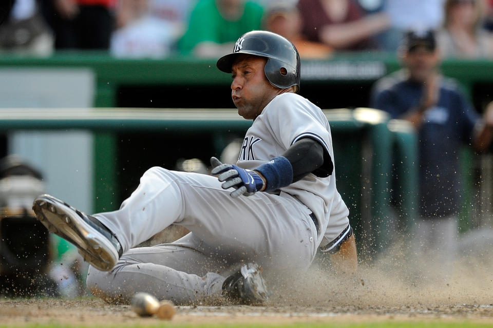 WASHINGTON, DC - JUNE 16: Derek Jeter #2 of the New York Yankees scores on a two run double by Mark Teixeira #25 in the fourteenth inning against the Washington Nationals at Nationals Park on June 16, 2012 in Washington, DC. (Photo by Patrick McDermott/Getty Images)