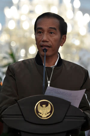 Indonesia President Joko Widodo talks to reporters after a protest against Jakarta's incumbent governor Basuki Tjahaja Purnama in Jakarta, Indonesia, November 5, 2016, in this picture taken by Antara Foto. Antara Foto/Puspa Perwitasari/via REUTERS