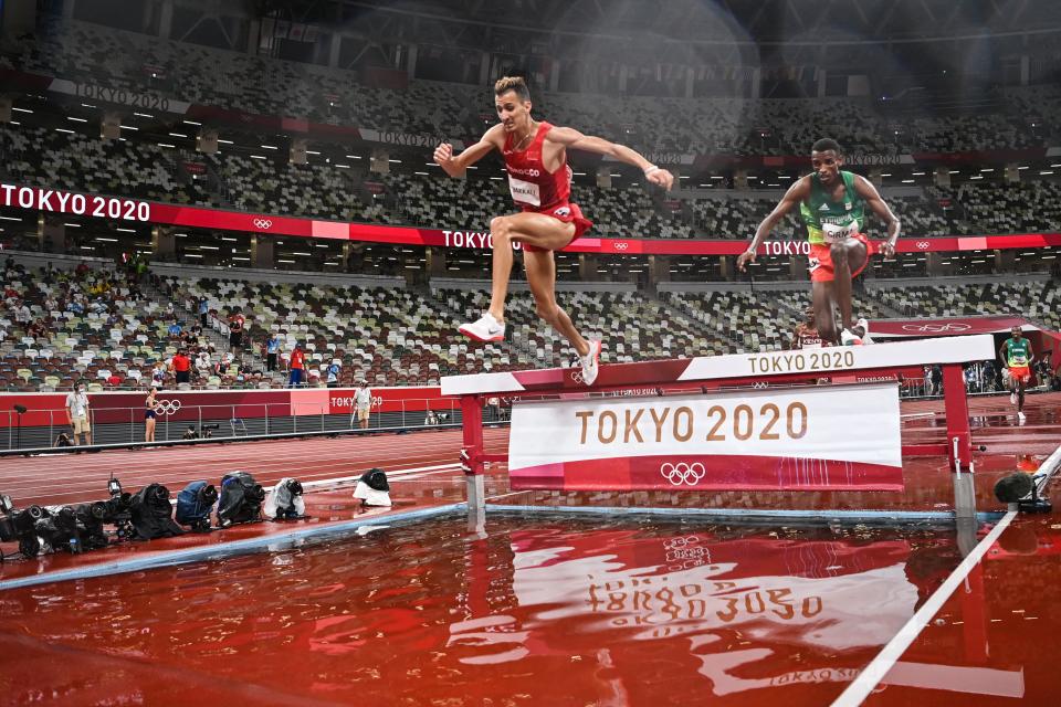 <p>TOPSHOT - Morocco's Soufiane El Bakkali (L) and Ethiopia's Lamecha Girma compete in the men's 3000m steeplechase final during the Tokyo 2020 Olympic Games at the Olympic Stadium in Tokyo on August 2, 2021. (Photo by Andrej ISAKOVIC / AFP) (Photo by ANDREJ ISAKOVIC/AFP via Getty Images)</p> 