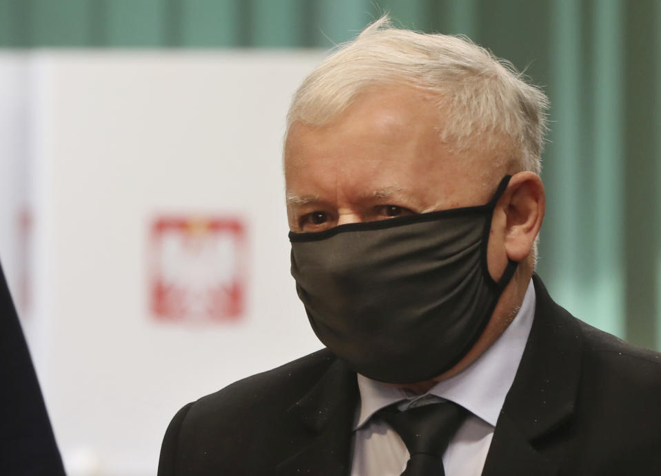 Poland's main ruling party leader Jaroslaw Kaczynski prepares to cast his vote during presidential election in Warsaw, Poland, Sunday, June 28, 2020. The election will test the popularity of incumbent President Andrzej Duda who is seeking a second term in office, and of the conservative ruling party that backs him. (AP Photo/Czarek Sokolowski)