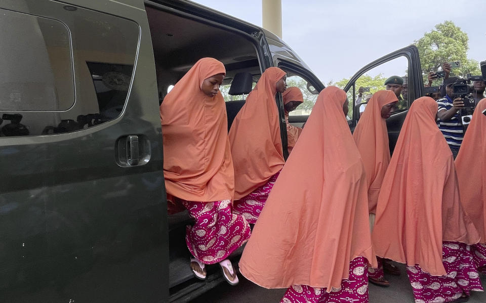 FILE - Freed students of the LEA Primary and Secondary School Kuriga leave a van upon arrival at the government house in Kaduna, Nigeria, Monday, March 25, 2024. Their experience represents a worrying new development in Nigeria, Africa's most populous country where the mass abduction of Chibok schoolgirls a decade ago marked a new era of fear even as nearly 100 of the girls remain in captivity. An array of armed groups now focus on abducting schoolchildren, seeing in them a lucrative way to fund other crimes and control villages in the nation's mineral-rich but poorly-policed northwestern region. (AP Photo/Chinedu Asadu, File)