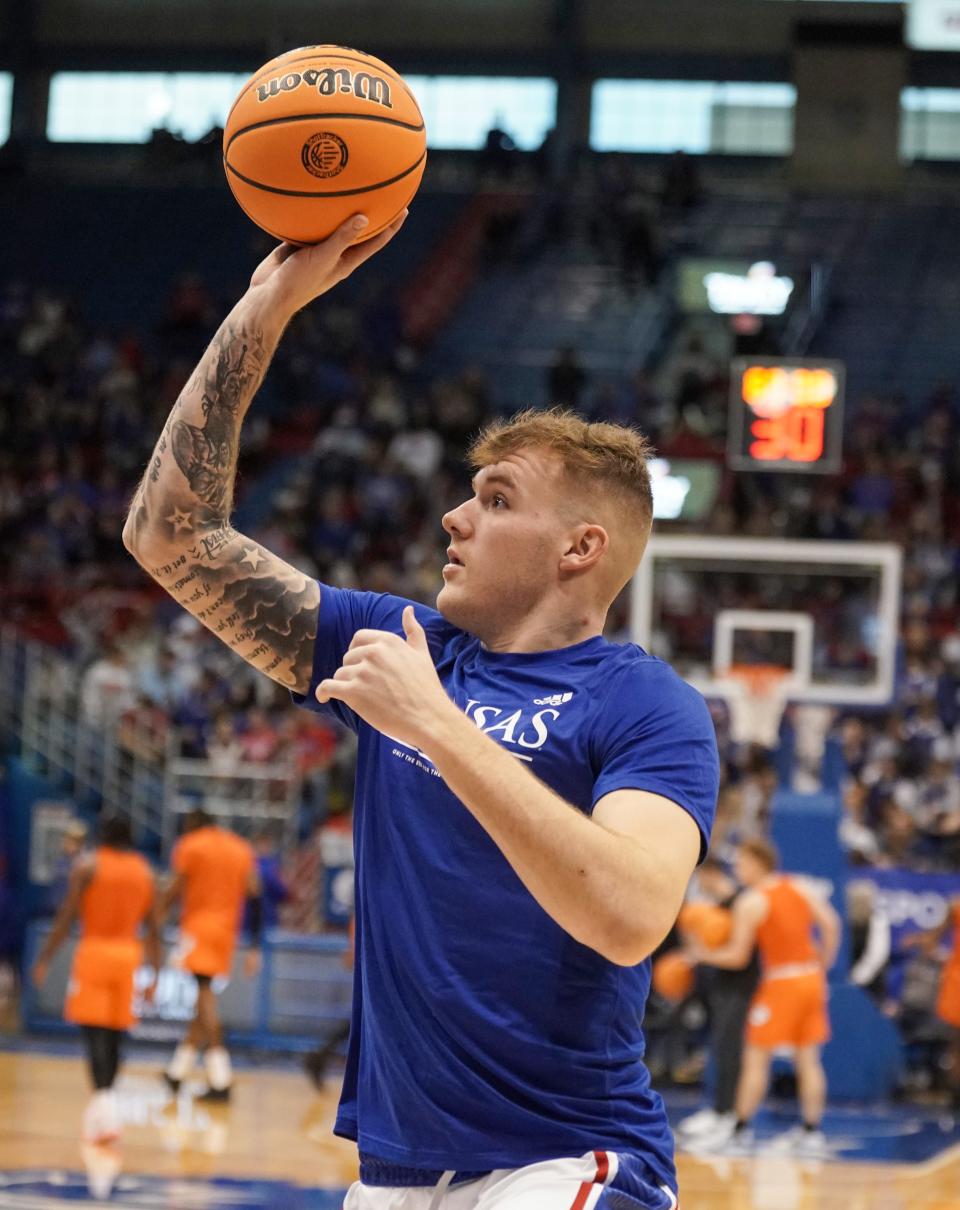 Kansas forward Cam Martin warms up prior to a game against Oklahoma State on Dec. 31, 2022 at Allen Fieldhouse.