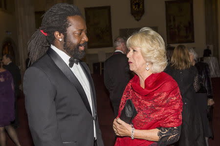 Britain's Camilla, Duchess of Cornwall speaks with nominated author Marlon James (L) at the ceremony for the Man Booker Prize for Fiction 2015 in London, Britain October 13, 2015. REUTERS/Neil Hall