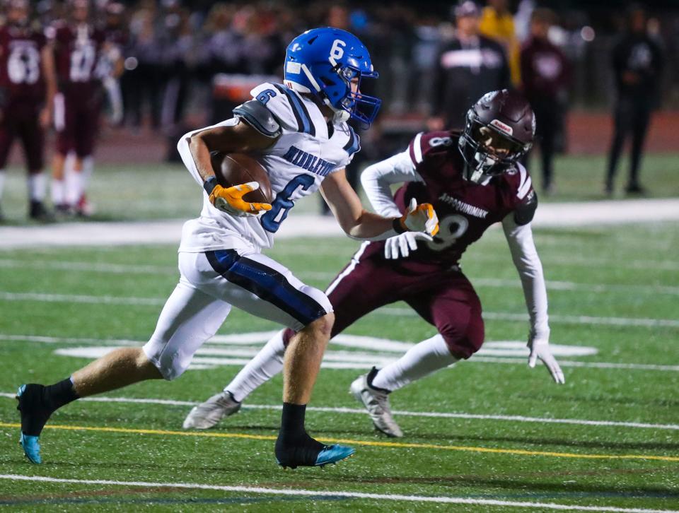 Middletown's Matthew Priestley (6) tries to elude Appoquinimink's Antwon Osborn in the first half of Middletown's 14-0 win at Appoquinimink High School, Friday, Sept. 23, 2022.