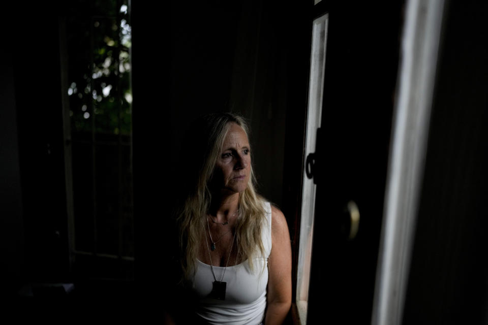 Marina Degtiar poses for a photo at her home in Buenos Aires, Argentina, Friday, Feb. 23, 2024. A bomb-laden van exploded inside the AMIA Jewish community center where her 21-year-old brother Cristian used to work, the worst bombing attack on civilians in Argentina's history, killed 85 — Degtiar's brother among them. (AP Photo/Natacha Pisarenko)