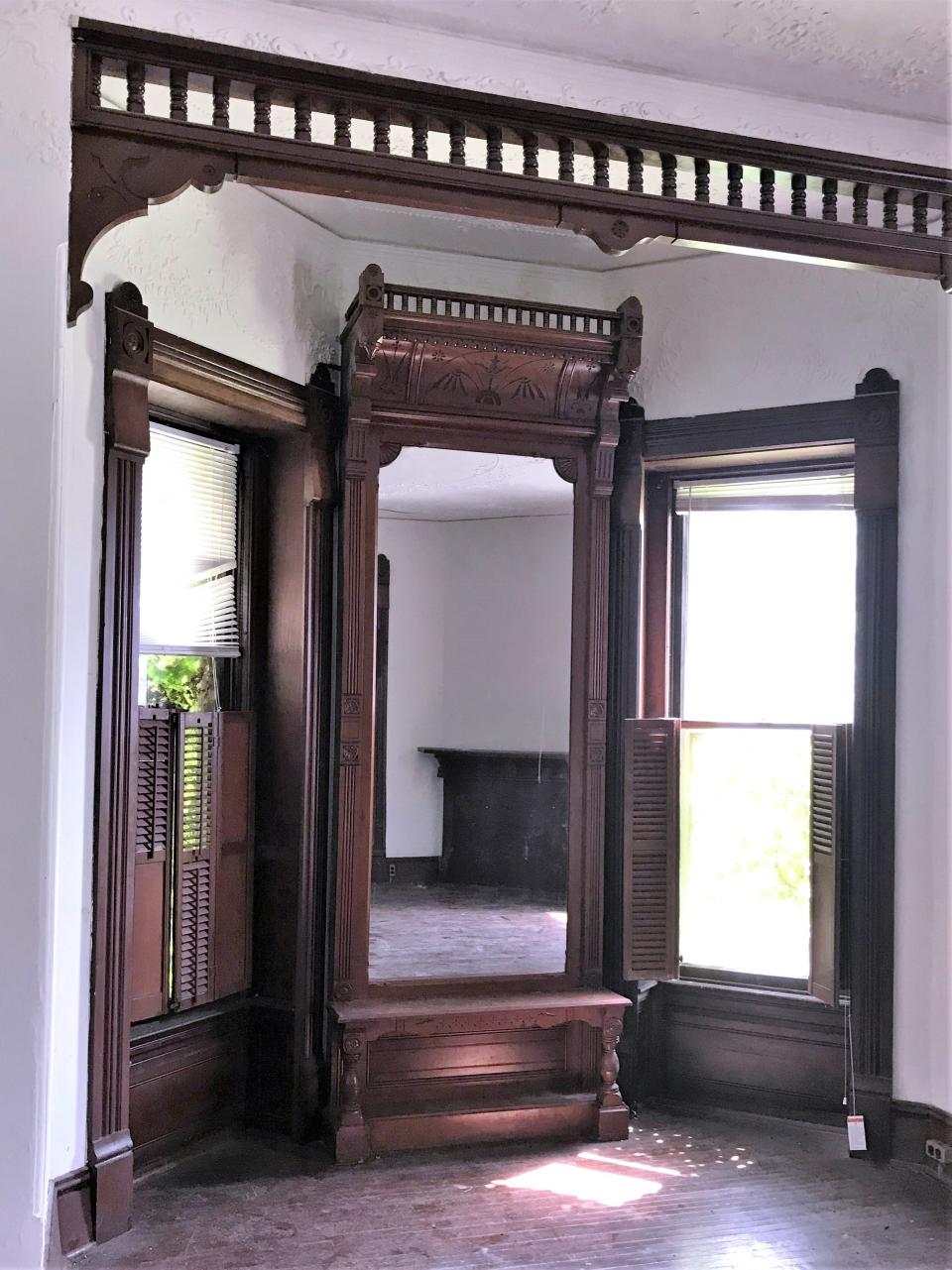 A full length mirror sits in a bedroom in the Strawberry Mansion at 415 William St. in Elmira.