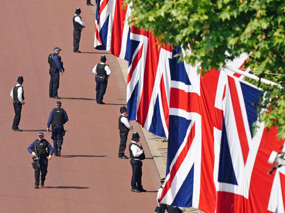 Police on The Mall shortly before the procession (PA)