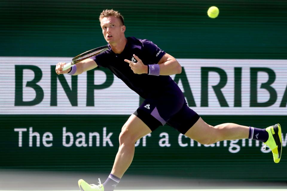 Jiri Lehecka returns to Stefanos Tsitsipas during their fourth-round match at the BNP Paribas Open in Indian Wells, Calif., on Tues., March 12, 2024.