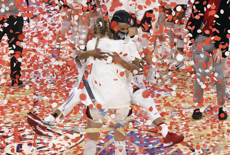 Stanford forward Cameron Brink, center left, and guard Kiana Williams, center right, celebrate after defeating UCLA following an NCAA college basketball game in the Pac-12 women's tournament championship Sunday, March 7, 2021, in Las Vegas. (AP Photo/Isaac Brekken)