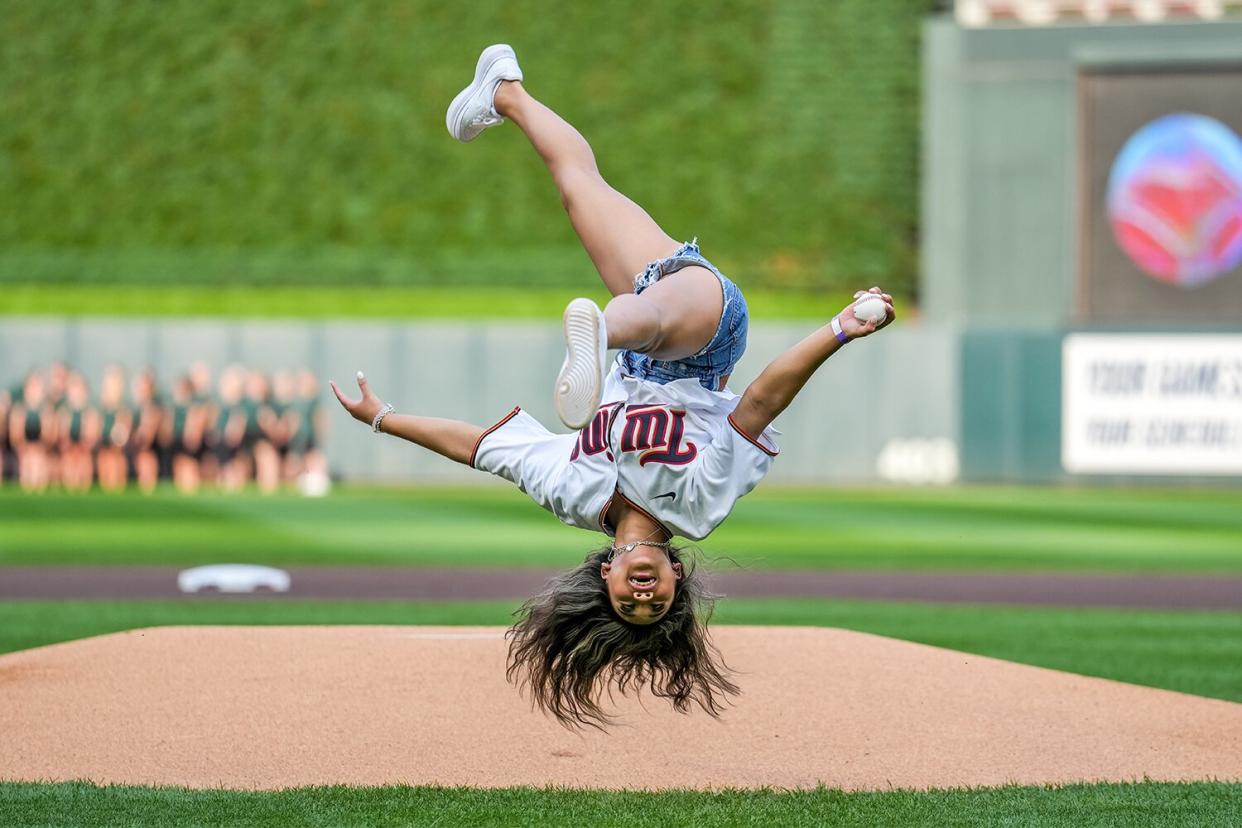 Olympian gymnast Suni Lee throws out the first pitch prior to the game between the Minnesota Twins and Toronto Blue Jays on August 5, 2022 at Target Field in Minneapolis, Minnesota.