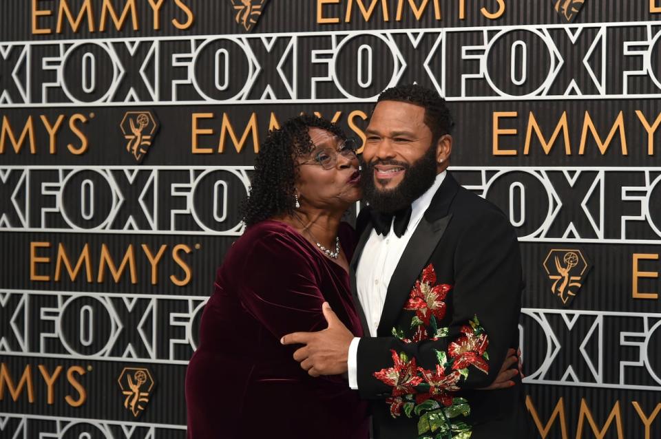 Anthony Anderson and his mother, Doris Bowman, arrive at the 75th Primetime Emmy Awards on Monday, Jan. 15, 2024, at the Peacock Theatre in Los Angeles. Anderson hosted the awards and his mother played a part, alerting winners when they were going over time on their speeches. 