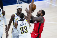 Houston Rockets guard John Wall (1) shoots over Indiana Pacers forward Myles Turner (33) during the fourth quarter of an NBA basketball game in Indianapolis, Wednesday, Jan. 6, 2021. (AP Photo/Michael Conroy)