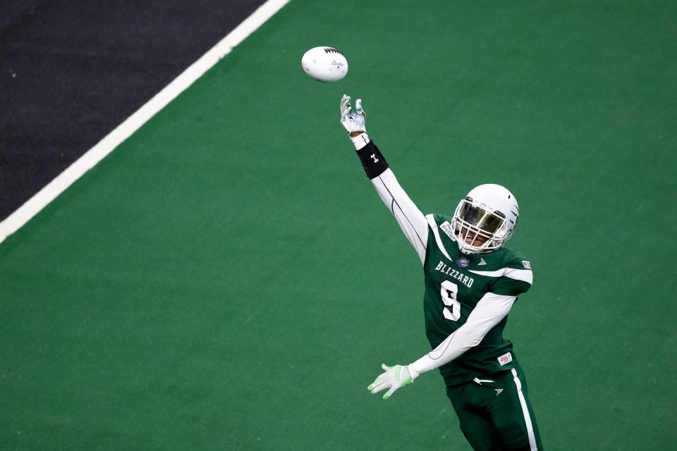 Green Bay Blizzard's Shaquan Curenton (9) attempts to catch a pass in the first half of the Indoor Football League game against the Massachusetts Pirates, Saturday, April 16, at the Resch Center in Ashwaubenon, Wis.