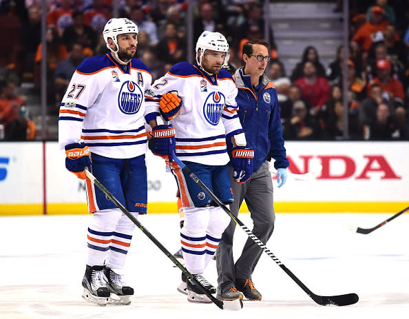 ANAHEIM, CA - MAY 05: Andrej Sekera #2 of the Edmonton Oilers is helped off the ice by Milan Lucic #27 and a trainer during the first period against the Anaheim Ducks in Game Five of the Western Conference Second Round during the 2017 NHL Stanley Cup Playoffs at Honda Center on May 5, 2017 in Anaheim, California. (Photo by Harry How/Getty Images)