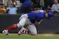 Chicago Cubs' Seiya Suzuki reacts after hitting an inside-the-park home run during the ninth inning of a baseball game against the Milwaukee Brewers Monday, July 4, 2022, in Milwaukee. (AP Photo/Morry Gash)
