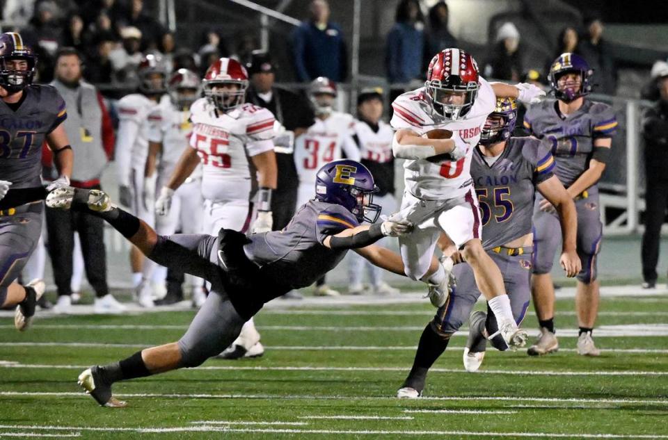 Patterson’s Coby Joseph slips past Escalon’s Logan Huebner on a run during the Sac-Joaquin Section Division IV championship game at St. Mary’s High School in Stockton, Calif., Friday, Nov. 24, 2023.