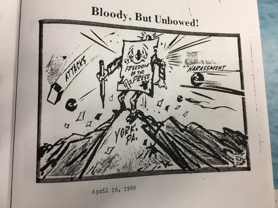 Walt Partymiller shows the news media – really his Gazette and Daily – under attack from all sides. Reporters for owner J.W. Gitt’s newspaper were getting physically and verbally assaulted by police and gangs in this era of York’s race riots. In one case, police smashed a journalist’s camera, exposed the film and sicced a police dog on the newsman. The newspaper’s office also was firebombed, though damage was slight. Leaders in the Black community also criticized the newspaper, saying its reporters were exploiting the riots in their stories.