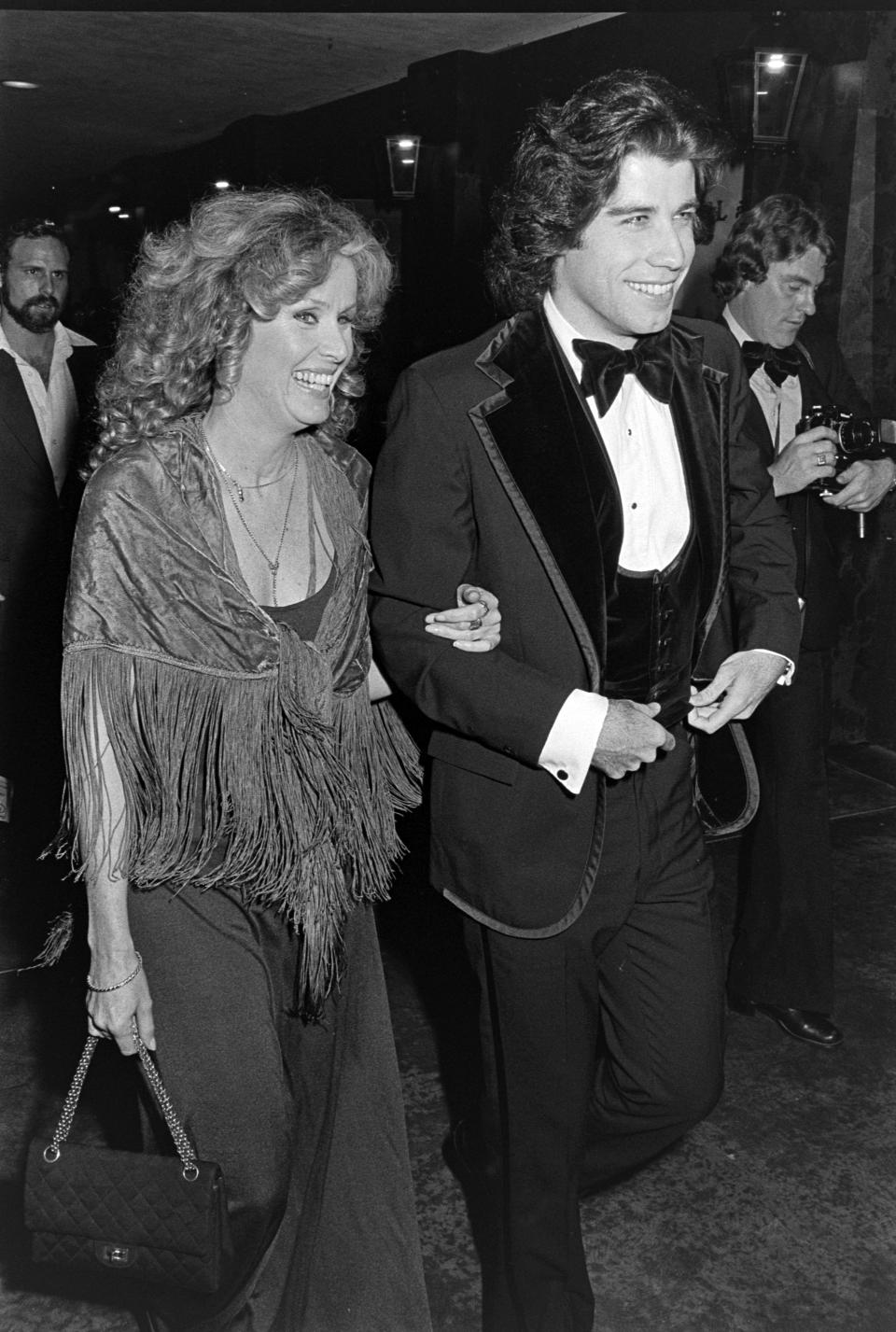 Diana Hyland and John Travolta attend an event at the Santa Monica Civic Auditorium in Santa Monica, California, on November 20, 1976. (Photo by Fairchild Archive/Penske Media via Getty Images)