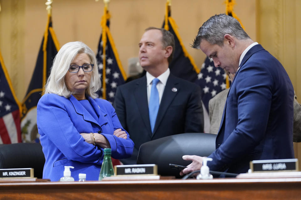 Vice Chair Liz Cheney, R-Wyo., Rep. Adam Schiff, D-Calif., and Rep. Adam Kinzinger, R-Ill., stand together during a break as the House select committee investigating the Jan. 6 attack on the U.S. Capitol holds its first public hearing to reveal the findings of a year-long investigation, at the Capitol in Washington, Thursday, June 9, 2022. (AP Photo/J. Scott Applewhite)