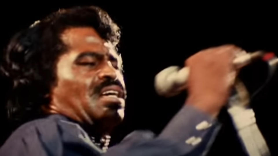 Close up of James Brown singing