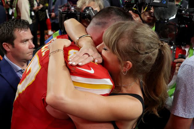 Travis Kelce celebrating his win at the Super Bowl with Taylor Swift