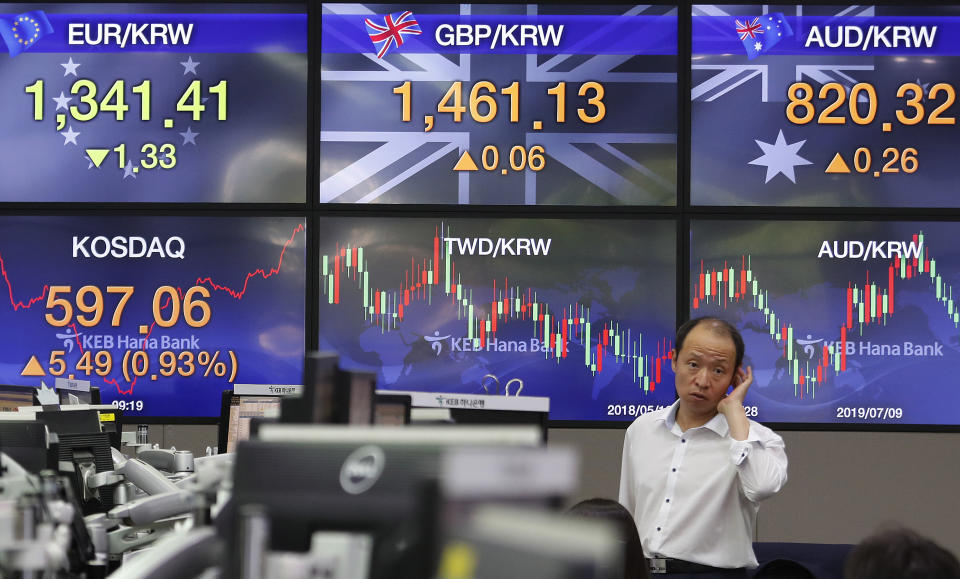 A currency trader works at the foreign exchange dealing room of the KEB Hana Bank headquarters in Seoul, South Korea, Monday, Aug. 19, 2019. Asian shares were higher Monday, as investors continue to rejigger their read on President Donald Trump's trade war and growing worries about slowing economies around the world.(AP Photo/Ahn Young-joon)